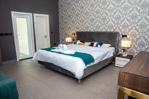 Giường trong phòng chung tại Seabreeze by Matteo