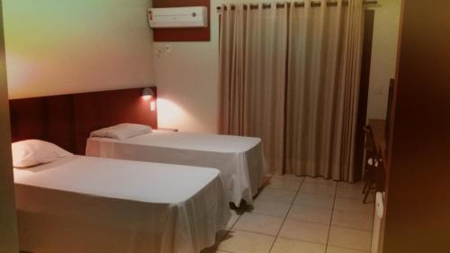 Katil atau katil-katil dalam bilik di Hotel Thermas Bonsucesso