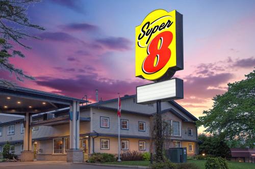 a sign for a speed eight restaurant in front of a building at Super 8 by Wyndham Sault Ste Marie On in Sault Ste. Marie