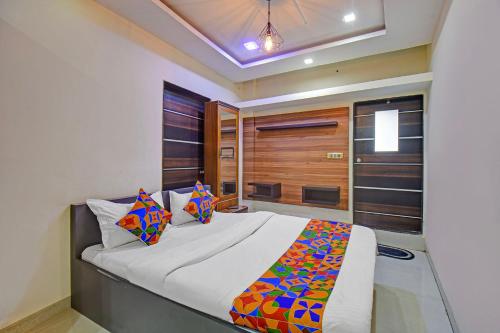 a bedroom with a large bed in a room at Via Classic Square I in Pune