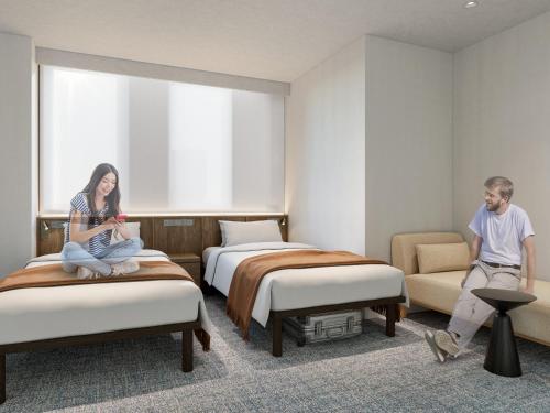 Ένα ή περισσότερα κρεβάτια σε δωμάτιο στο The OneFive Tokyo Kameido