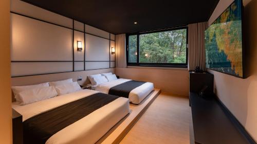 Ένα ή περισσότερα κρεβάτια σε δωμάτιο στο Mitasuya Ryokan Hotel Gongju Donghaksa Temple by Aank