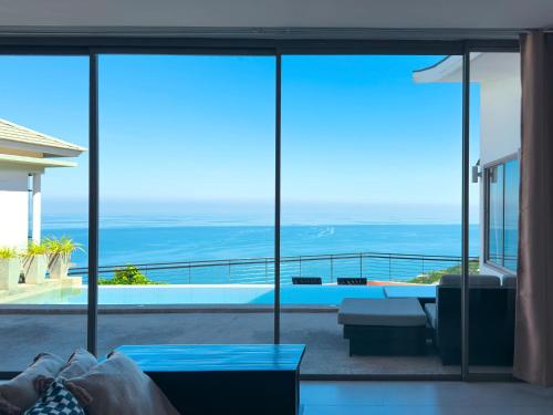 a room with a view of the ocean from a house at Staylar Seaview Pool Villa Gina Chaweng Noi in Bophut 