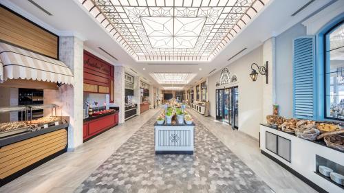 a large kitchen with aasteryasteryasteryasteryasteryasteryasteryasteryasteryasteryastery at Club Marco Polo - Premium All Inclusive in Kemer