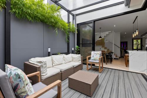 a living room with a couch and a table at Spacious Family-Friendly 5-BR Home in Glebe in Sydney