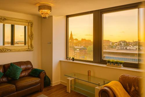 a living room with a couch and a glass table at Sidemersey Livings - 2 Bedroom Central Apartment with views in Liverpool