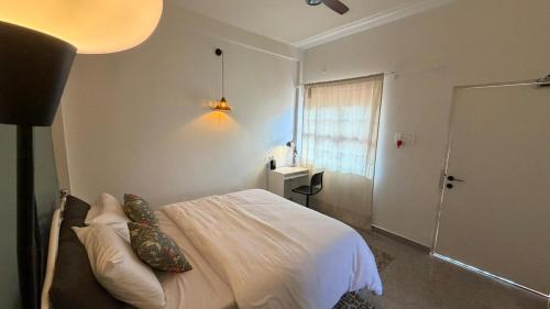 Giường trong phòng chung tại Wonderland Mandrem