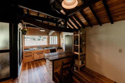a kitchen with wooden floors and a counter top at Casa de Mano - Vacation STAY 21638v in Mihara