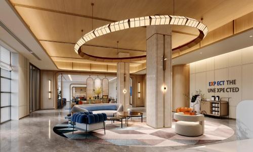 a lobby of a hotel with a living room at Holiday Inn Express Qingdao Downtown by IHG in Qingdao