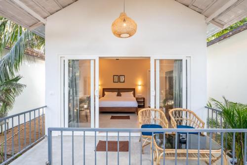 a view of a bedroom from the balcony of a house at Agonda Brown Sand in Agonda