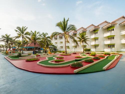 a resort with palm trees and a red carpet at Hotel Las Americas Casa de Playa in Cartagena de Indias