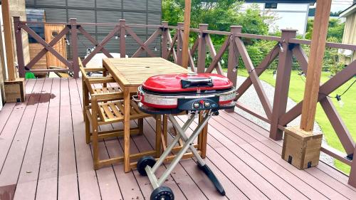 a suitcase on a cart on a deck at Solana富士御殿場 in Gotemba