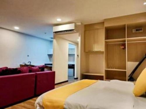 Ένα ή περισσότερα κρεβάτια σε δωμάτιο στο Kidurong Inn