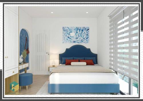 a bedroom with a blue bed with a blue headboard at Villa Malibu Tropicana , Nova Hồ Tràm in Ấp Thanh Bình