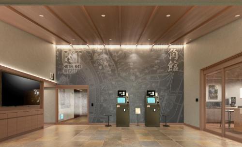 a room with a wall with writing on it at Hotel B4T Kakunodate in Senboku