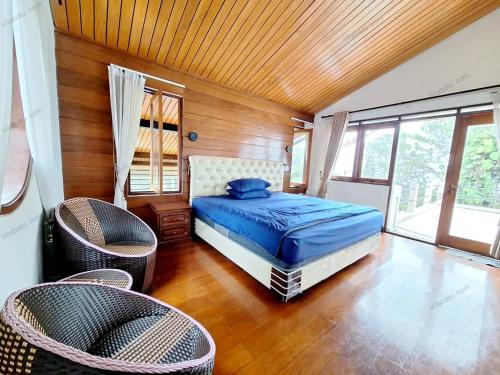 Postel nebo postele na pokoji v ubytování Rumah Kolam Pribadi