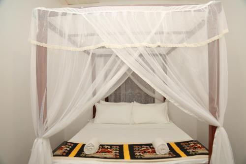 Ένα ή περισσότερα κρεβάτια σε δωμάτιο στο Shine Breeze villa