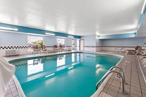 a pool with blue water in a hotel room at Quality Inn & Suites Springfield Southwest near I-72 in Springfield