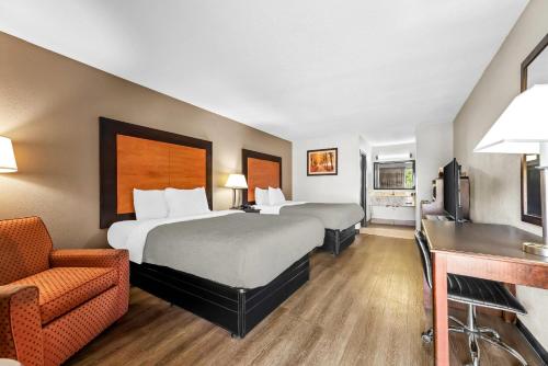 Ένα ή περισσότερα κρεβάτια σε δωμάτιο στο Quality Inn