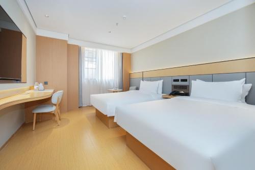 Ένα ή περισσότερα κρεβάτια σε δωμάτιο στο JI Hotel Shanghai Zaoji Road