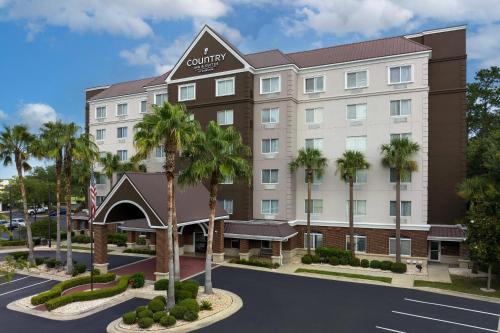 an image of a rendering of the courtyard hotel at Country Inn & Suites by Radisson, Gainesville, FL in Gainesville