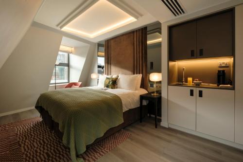 Ένα ή περισσότερα κρεβάτια σε δωμάτιο στο The Hobson Cambridge by Adina