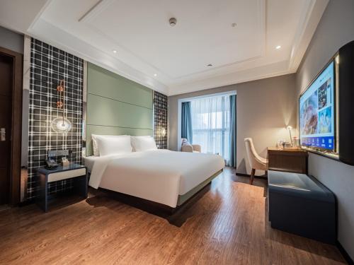 Postel nebo postele na pokoji v ubytování Starway Hotel Chengdu High-Tech New Exhibition Center