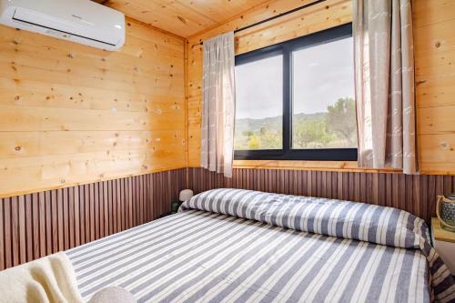 Ένα ή περισσότερα κρεβάτια σε δωμάτιο στο Minicasa La Barca