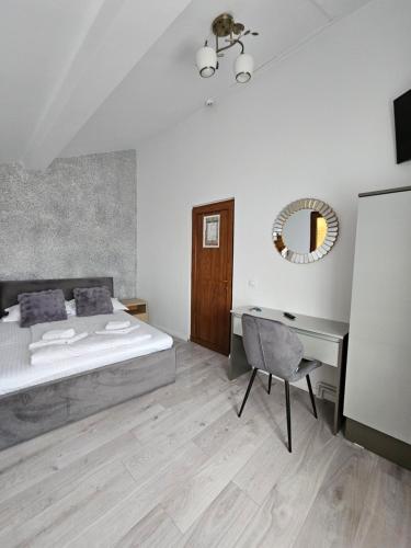 En eller flere senge i et værelse på CAMERE de ÎNCHIRIAT DARIA