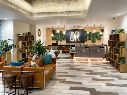 a library with couches and a r pharmacy at Green Rich Hotel Miyazaki Tachibandori 2 (Artificial hot spring Futamata Yunohana) in Miyazaki