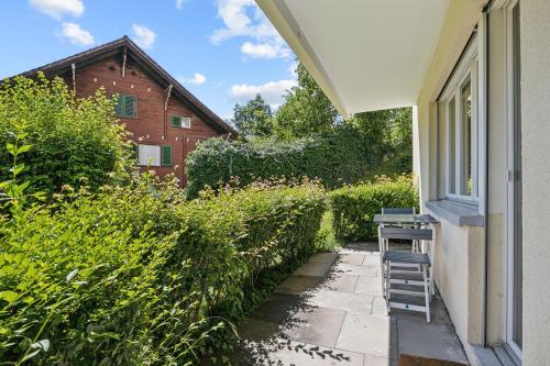 a ladder sitting on a porch next to a window at Pearlstay - Quiet Location Workplace Parking Washer in Schaffhausen