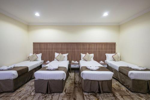 Ένα ή περισσότερα κρεβάτια σε δωμάτιο στο فندق سما الجوري