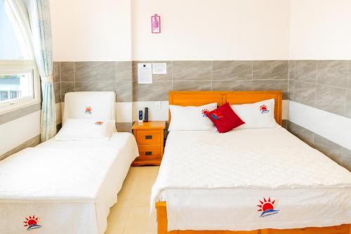 Ένα ή περισσότερα κρεβάτια σε δωμάτιο στο Thái Dương Hotel