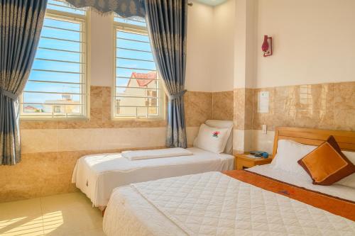 Ένα ή περισσότερα κρεβάτια σε δωμάτιο στο Thái Dương Hotel