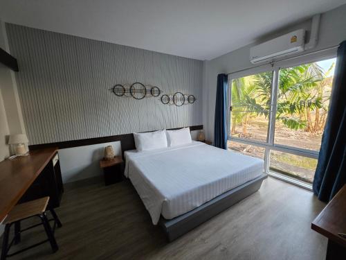 Postel nebo postele na pokoji v ubytování The One Cozy