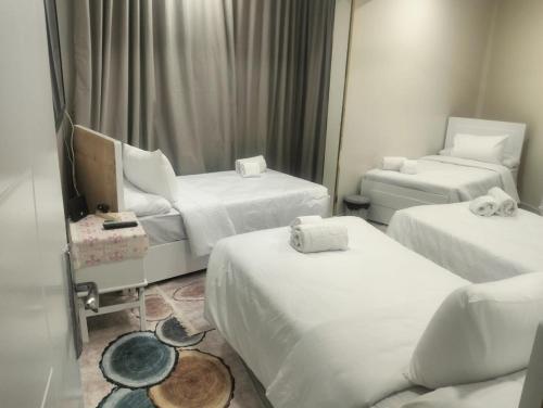 En eller flere senge i et værelse på Aswan Key Cozy