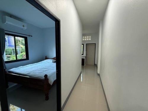 Postel nebo postele na pokoji v ubytování Baan Tai Gardens