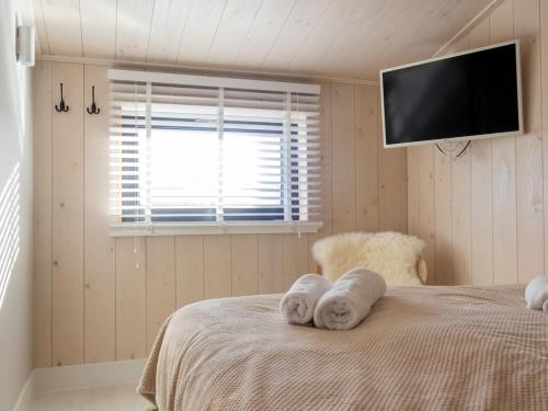 Ένα ή περισσότερα κρεβάτια σε δωμάτιο στο Luxe Verblijf in een Waterlodge aan de Waterkant