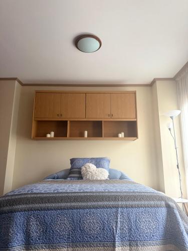 Ένα ή περισσότερα κρεβάτια σε δωμάτιο στο Vigo Estudio 21