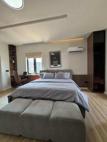 Ένα ή περισσότερα κρεβάτια σε δωμάτιο στο Lux 2bed highrise with city and ocean views in Victoria Island