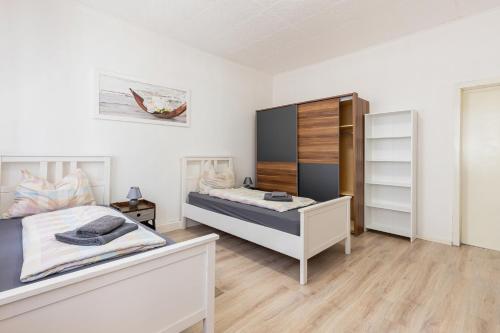 Ένα ή περισσότερα κρεβάτια σε δωμάτιο στο FLEX Aparts - möblierte Wohnung in Zwickau