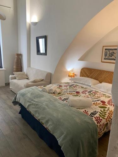 Ένα ή περισσότερα κρεβάτια σε δωμάτιο στο B&B LE TRE CHIOCCIOLE