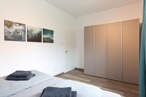 a bedroom with a bed and a large closet at Am Hafen 8 in Röbel