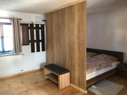 Кровать или кровати в номере Ferienwohnung alte Dorfmühle