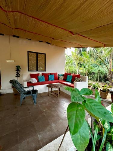 a living room with a couch and a table at Solaya Living - Boutique Holiday Home - 1 min to the beach in Magdāl