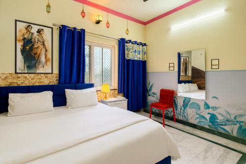 Postel nebo postele na pokoji v ubytování Anukampa Paying Guest House