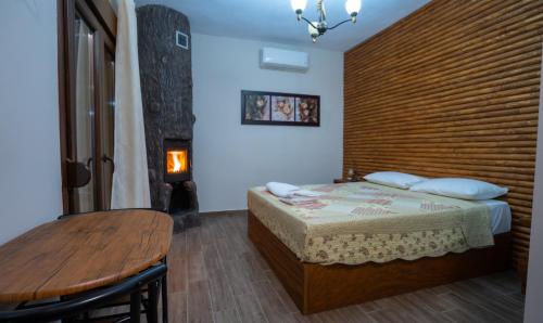 En eller flere senge i et værelse på Pozar Park Rooms