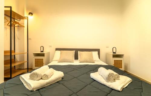 Ένα ή περισσότερα κρεβάτια σε δωμάτιο στο Le rose di Mimmo Casa vacanze