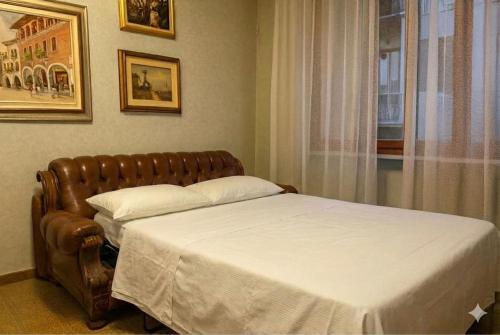 Ένα ή περισσότερα κρεβάτια σε δωμάτιο στο Giuditta Apartment