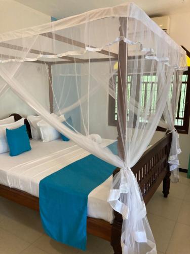 Ένα ή περισσότερα κρεβάτια σε δωμάτιο στο Mealanie's House